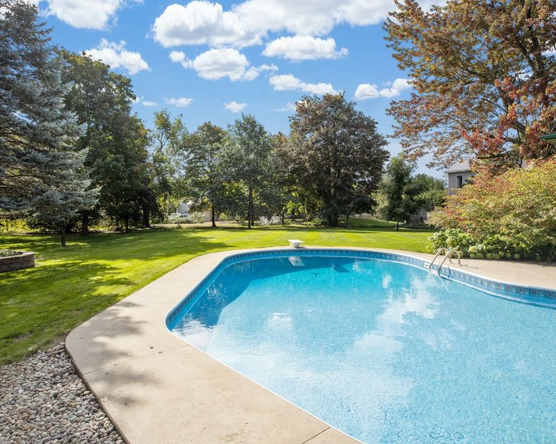 Swimming pool in a green farm garden